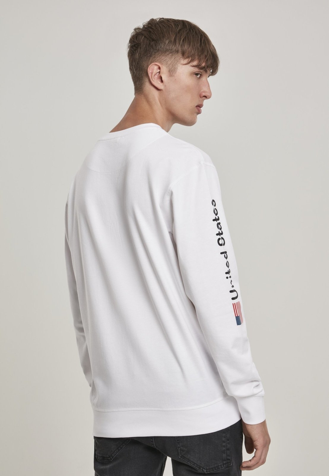 NASA United States Longsleeve crewneck shirt featuring a meaningful front and sleeve print, made from 100% cotton for comfort.