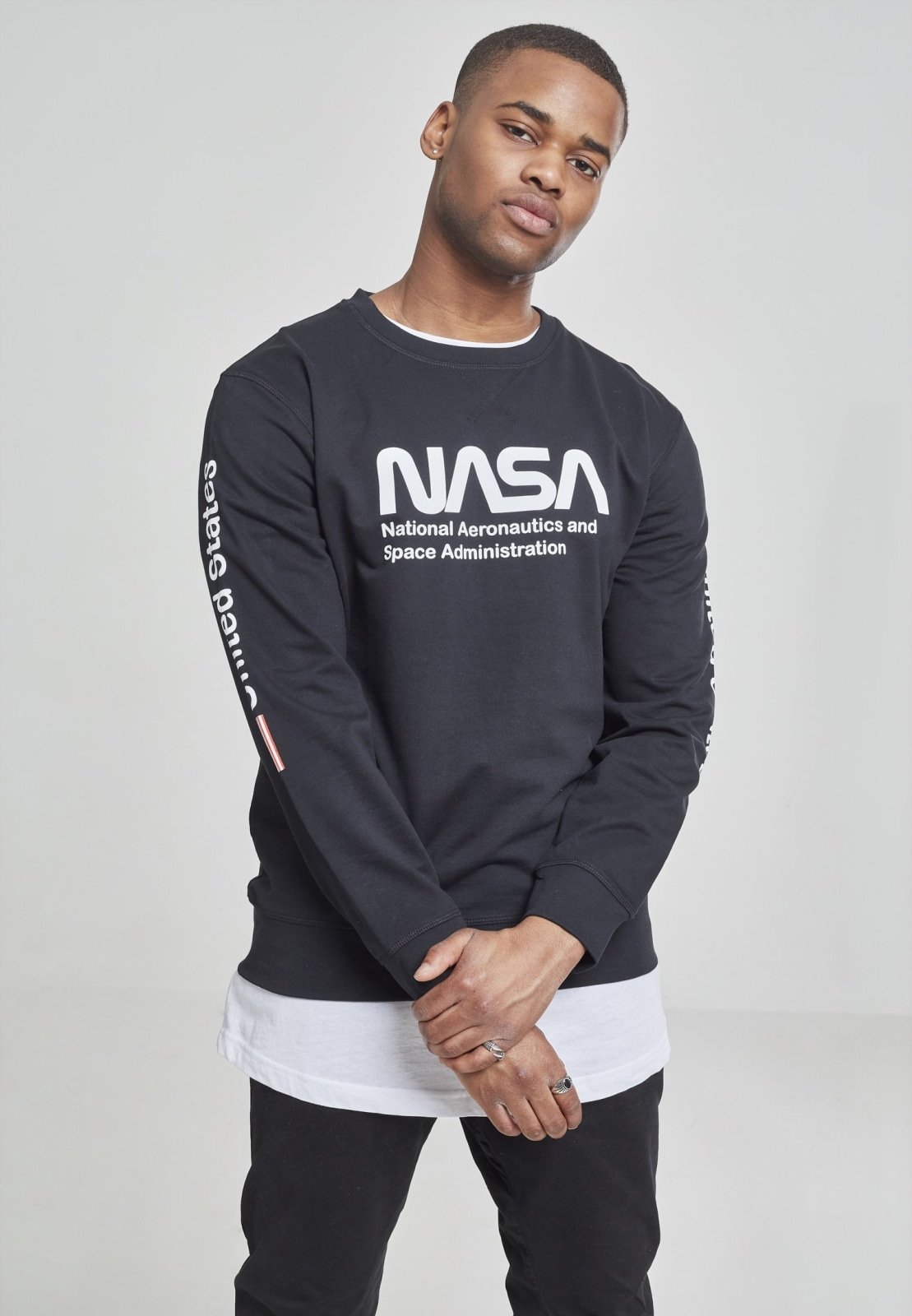 NASA United States Longsleeve crewneck shirt featuring a meaningful front and sleeve print, made from 100% cotton for comfort.