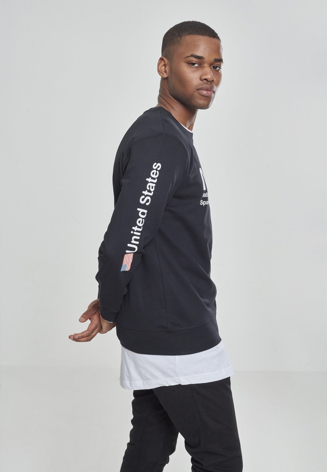 NASA United States Longsleeve crewneck shirt featuring a meaningful front and sleeve print, made from 100% cotton for comfort.