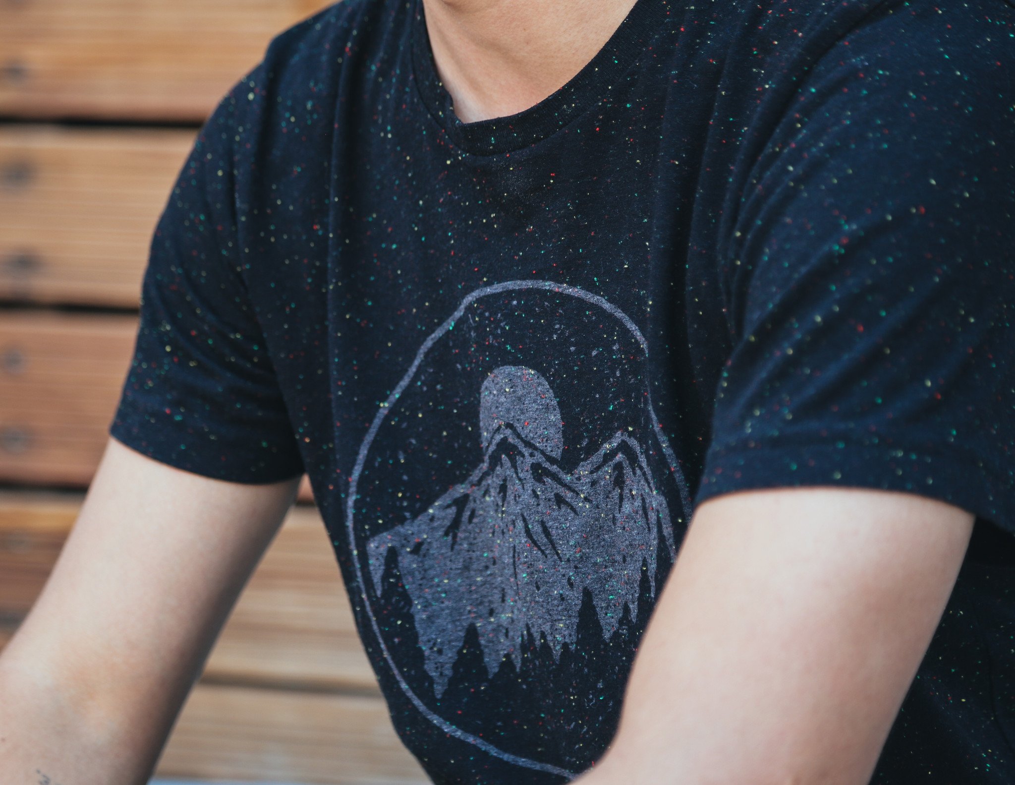 Night Sky Tee in speckled black with gray ink, showcasing a starry design, perfect for outdoor enthusiasts.