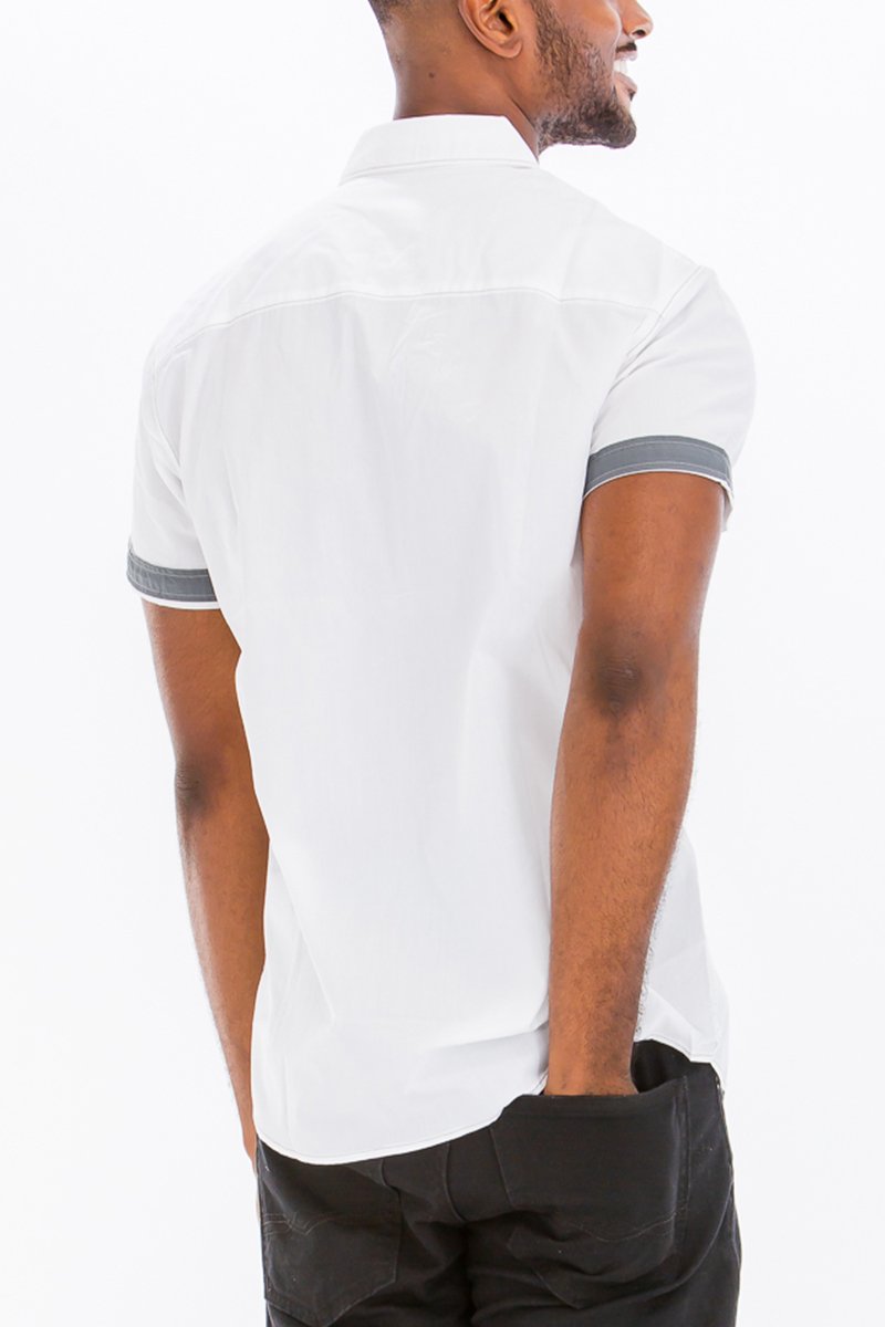 Outline Stitch Two Pocket Shirt in solid color with short sleeves and buttoned chest pockets, showcasing a casual and stylish design.