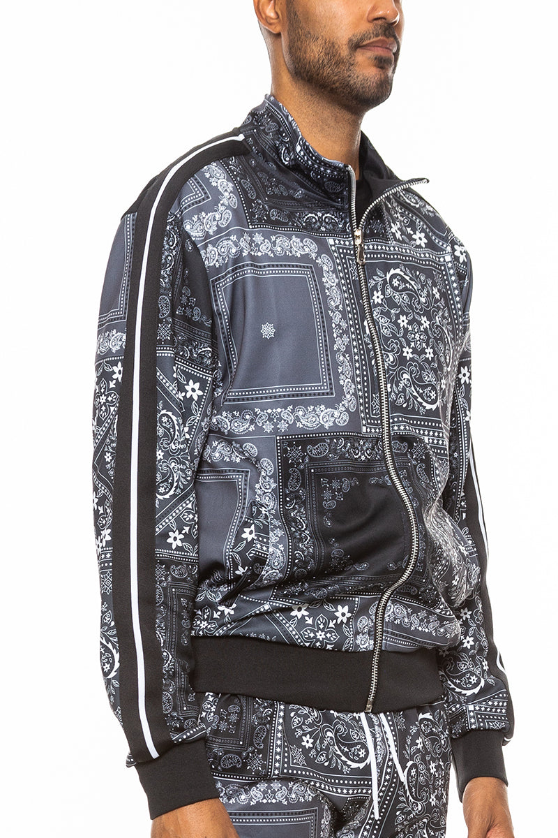 A stylish paisley all over print track jacket featuring a full zip design and collar, perfect for casual wear.