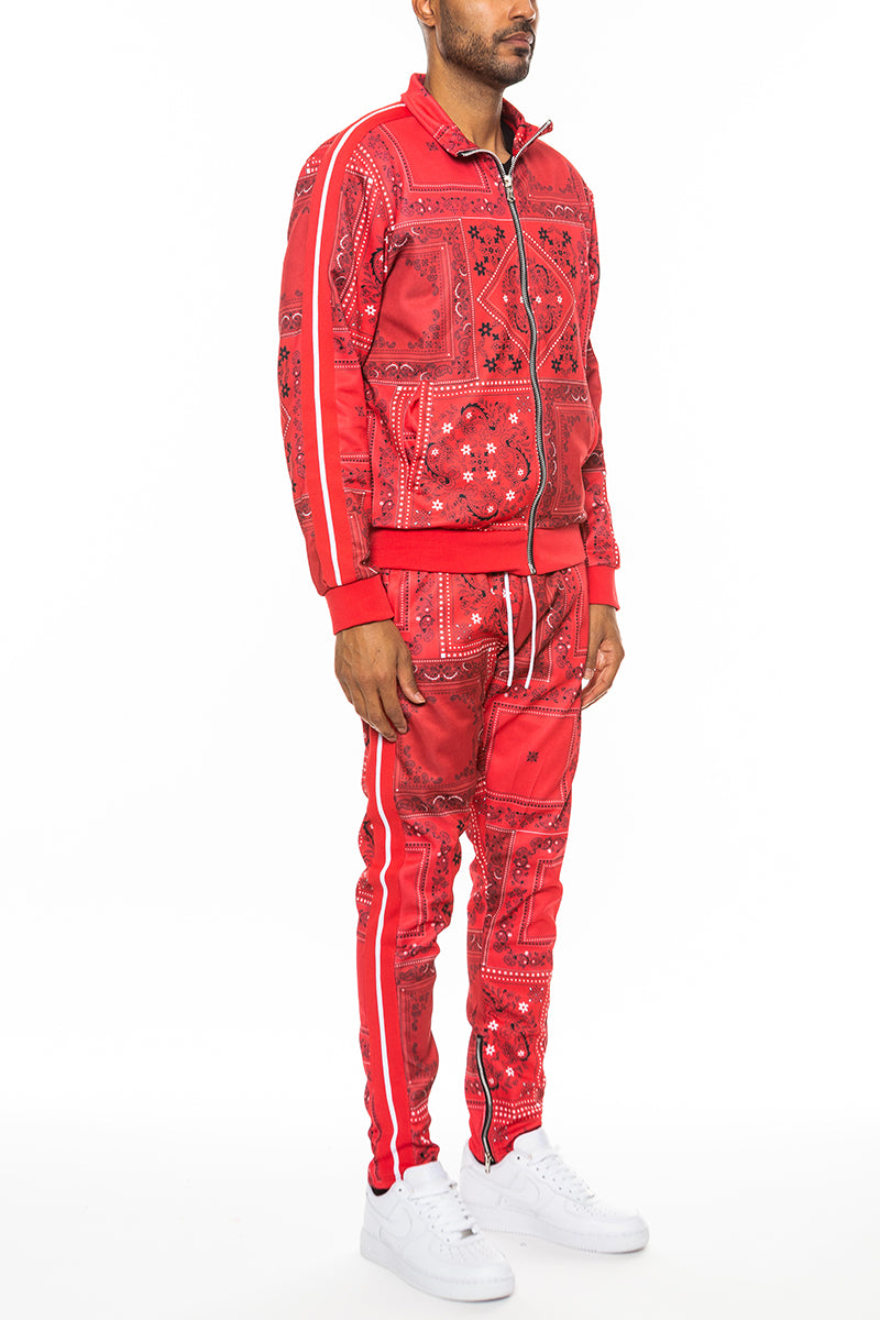 Paisley All Over Print Track Jacket Set featuring a vibrant design, full zip jacket, ribbed cuffs, and ankle zipper bottoms.