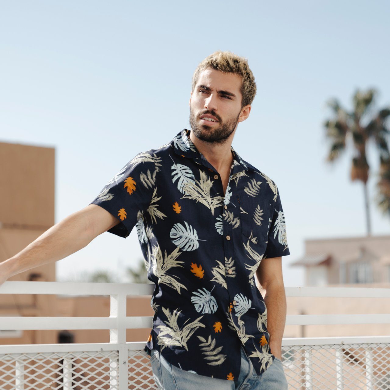 Parker Floral Shirt featuring a vibrant floral print on a short sleeve button-down design, made from 100% cotton.