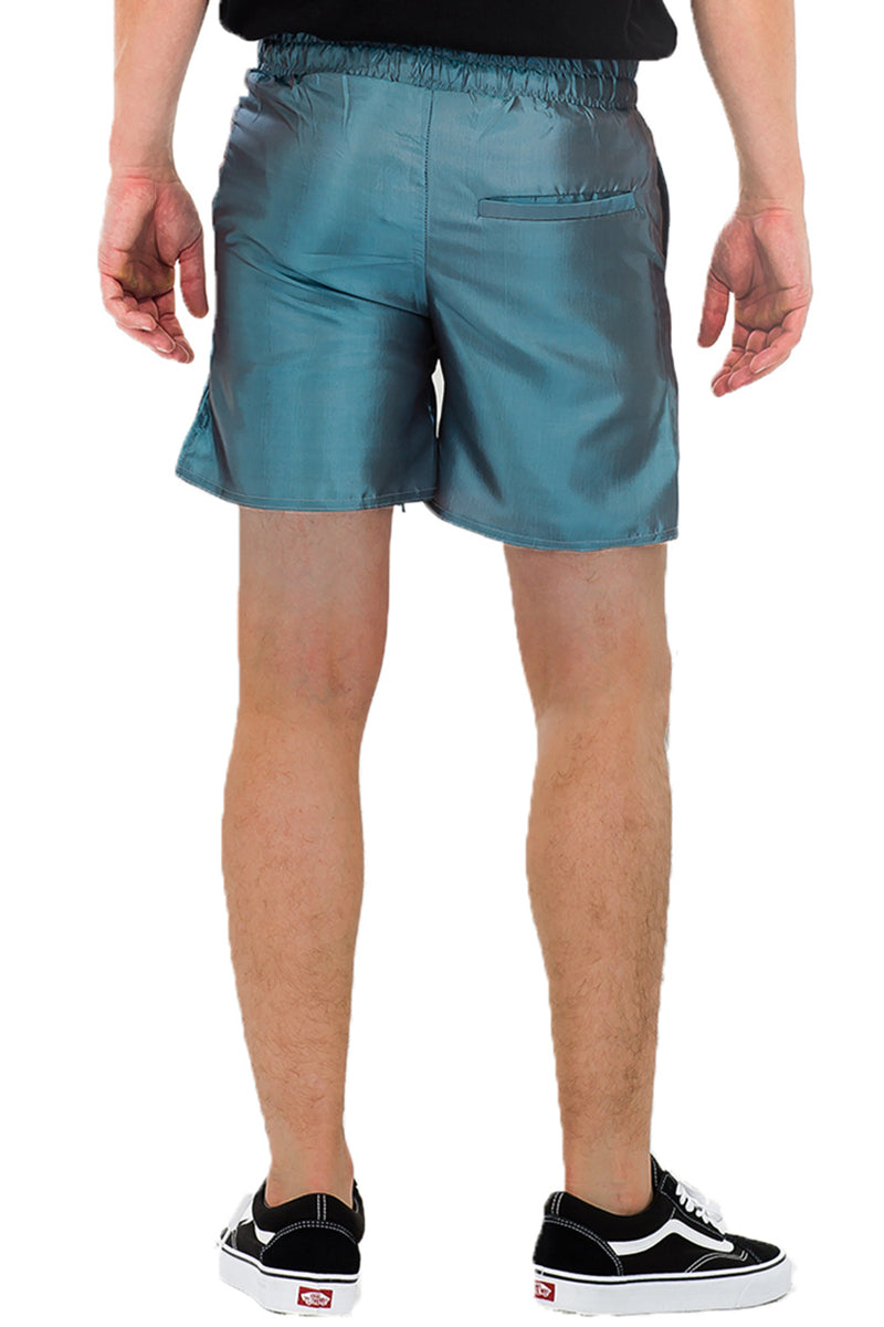 A pair of iridescent polyester peacock sheen shorts featuring an elastic waist with drawstring and two standard pockets, displayed on a neutral background.