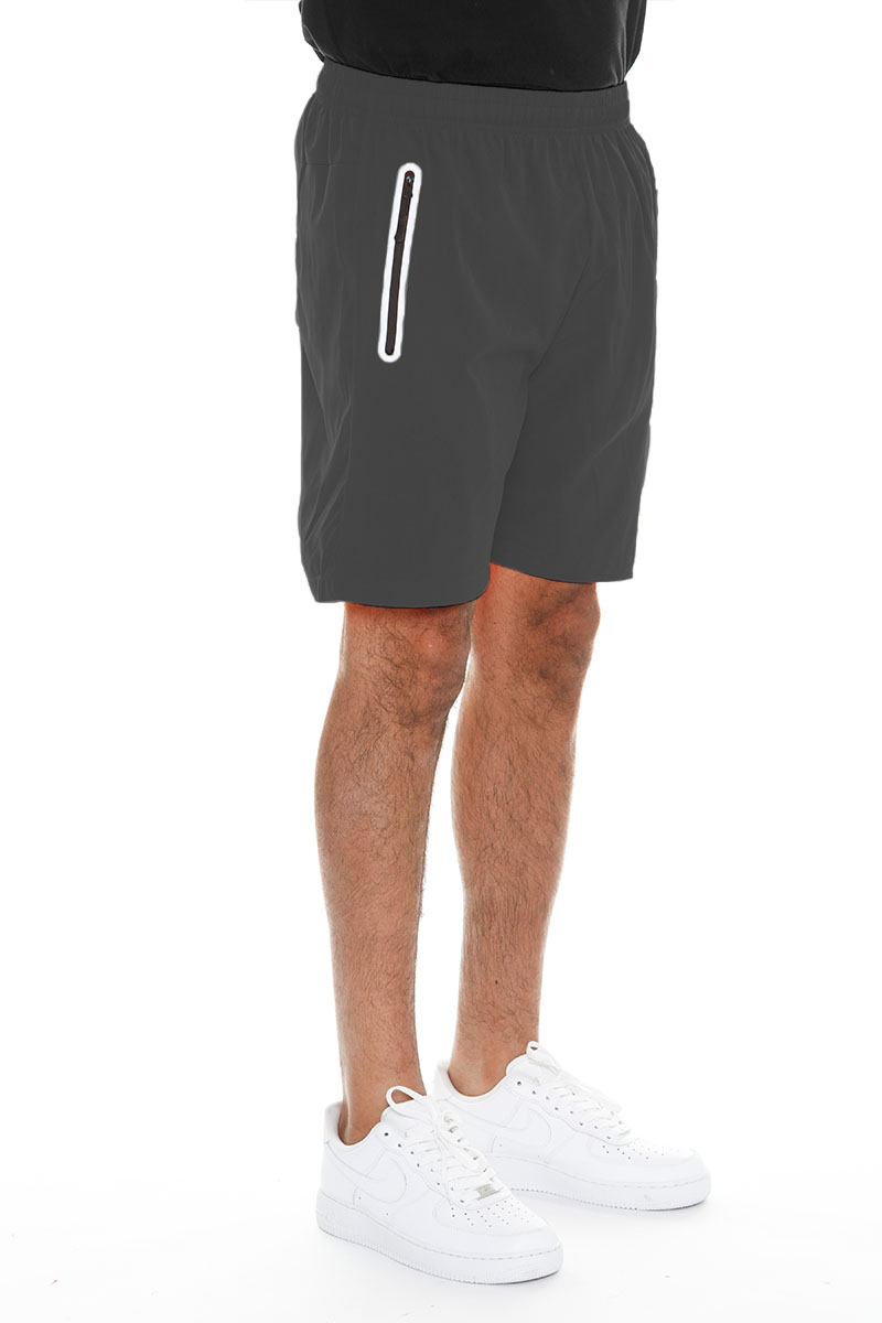 A pair of lightweight PERFORMANCE RUNNING SHORTS featuring zippered pockets and a reflective zipper, made from 100% polyester.