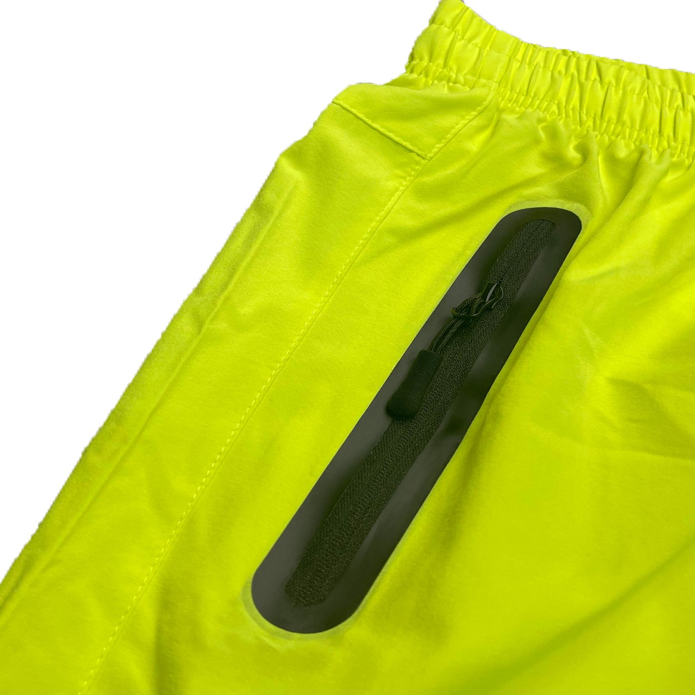 Lightweight PERFORMANCE RUNNING SHORTS featuring zippered pockets and reflective zipper for enhanced safety.