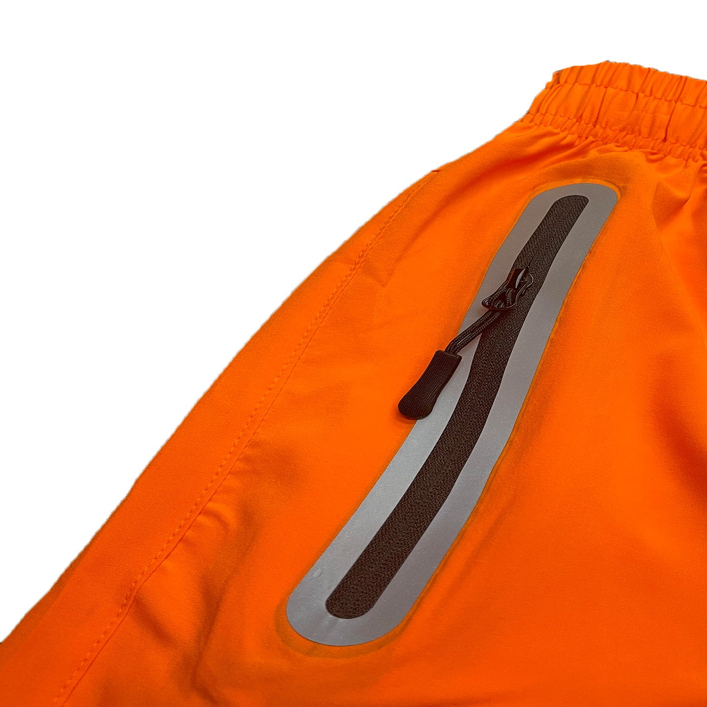 Lightweight PERFORMANCE RUNNING SHORTS featuring zippered pockets and reflective zipper for enhanced safety.