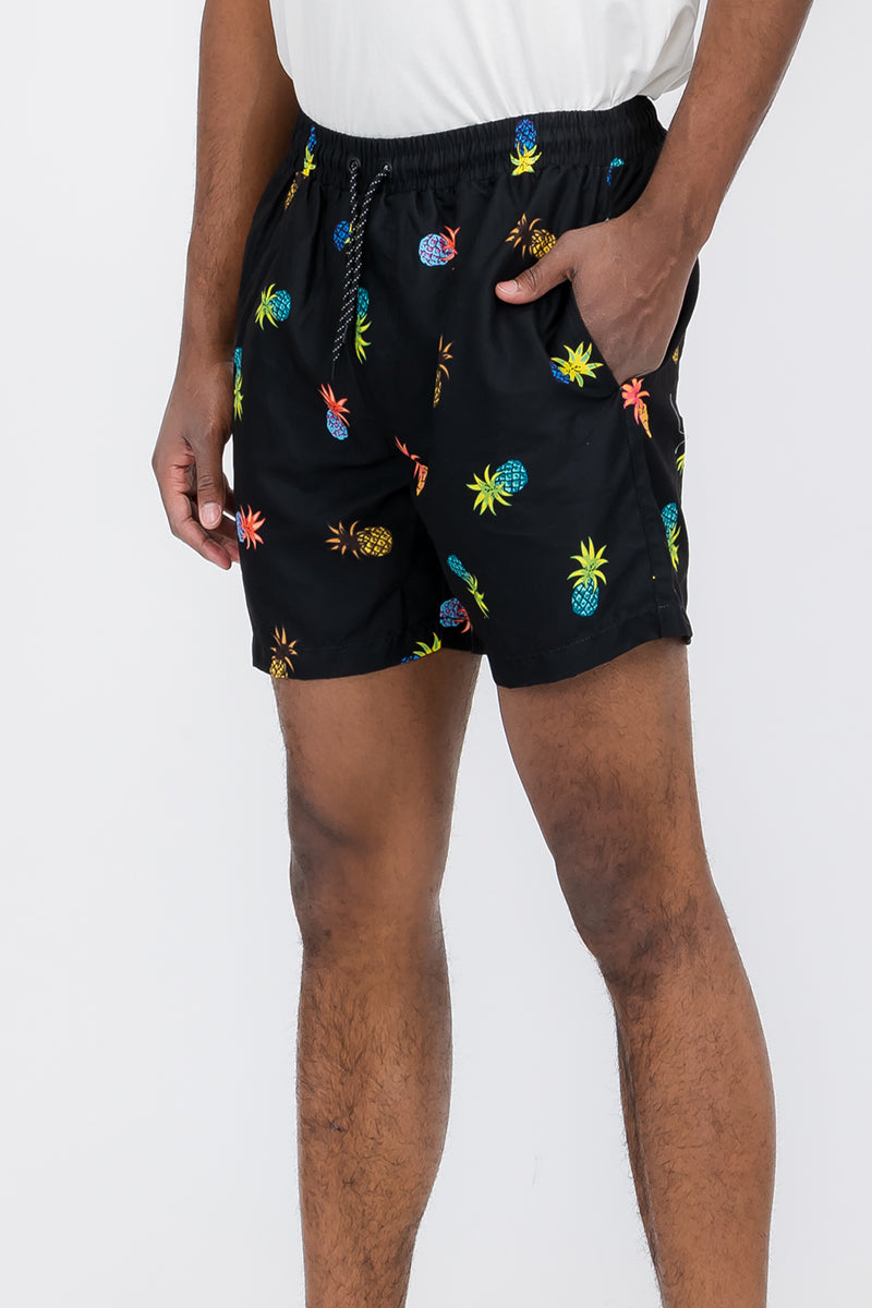 Pineapple Print Swim Shorts featuring vibrant tropical design, regular fit, and mesh lining for comfort.