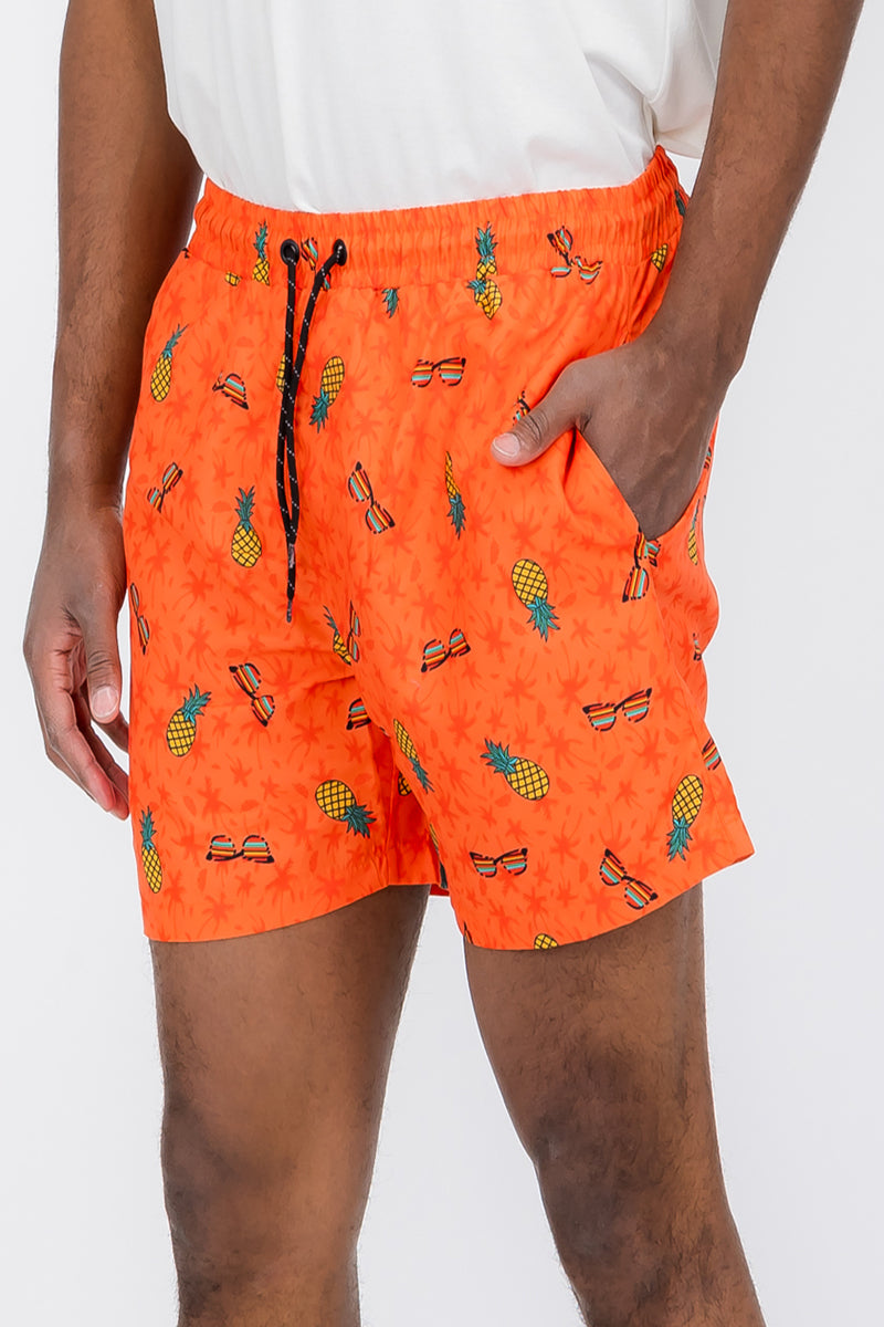 Pineapple Shade Print Swim Shorts featuring a vibrant tropical design, made from 100% polyester with mesh lining and pockets.