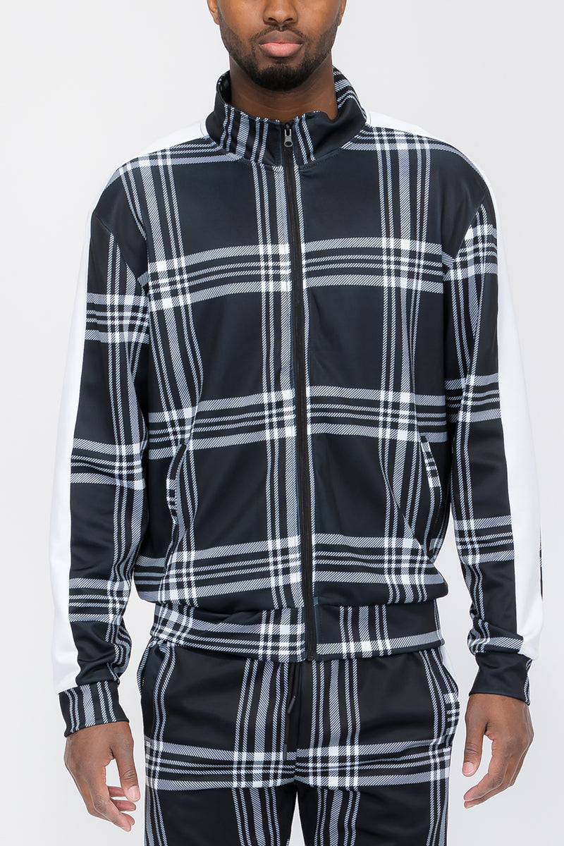 A stylish plaid out jacket featuring a full zip closure and standard pockets, perfect for layering in any season.