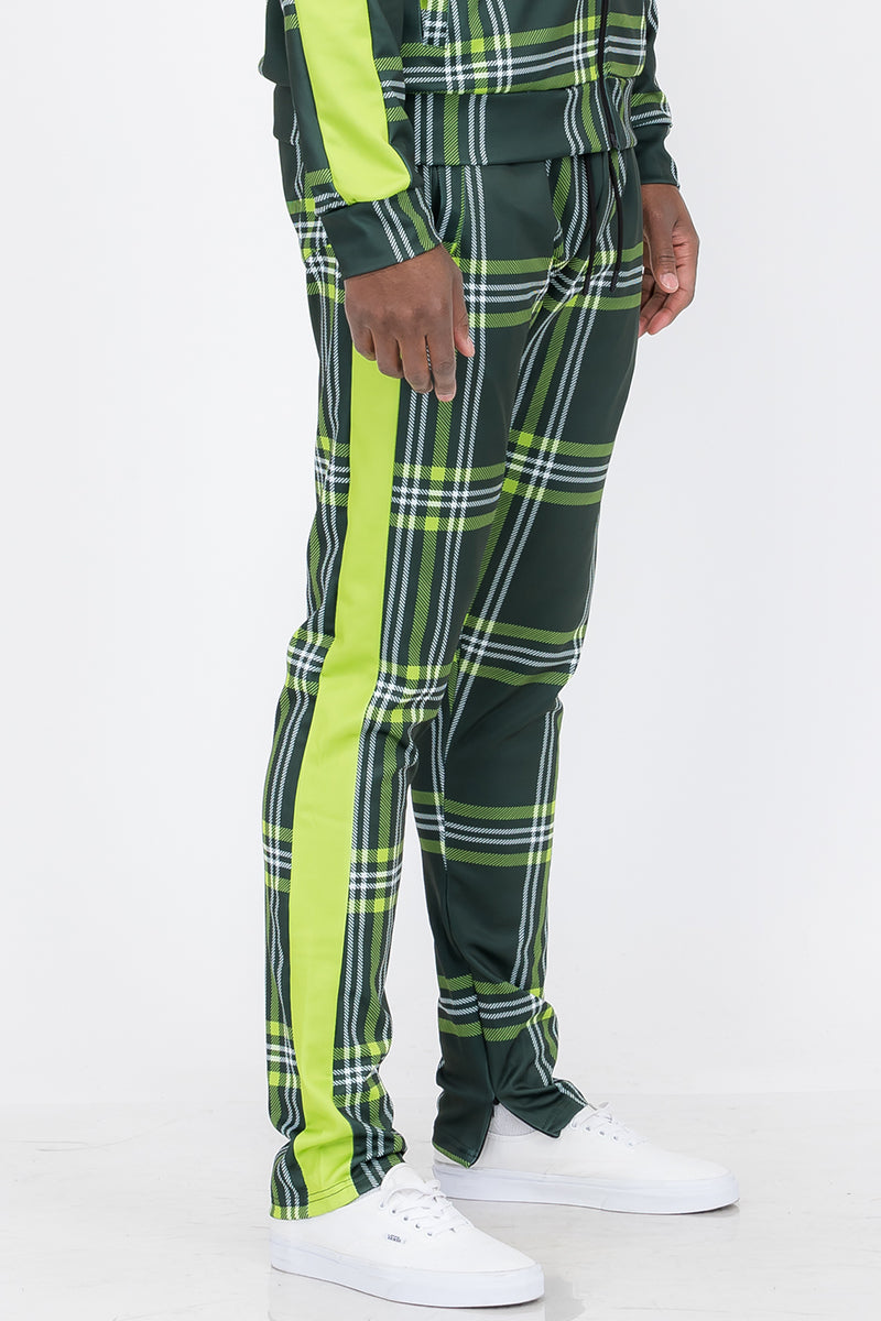 Plaid Out Track Pants featuring an elastic waist, drawstring, and ankle zippers, displayed on a model standing at 5'11 wearing a Large.