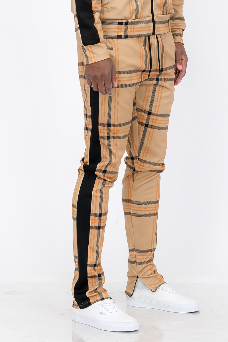 Plaid Out Track Pants featuring an elastic waist, drawstring, and ankle zippers, displayed on a model standing at 5'11 wearing a Large.