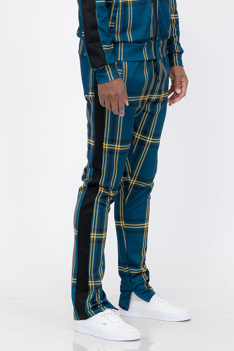 Plaid Out Track Pants featuring an elastic waist, drawstring, and ankle zippers, displayed on a model standing at 5'11 wearing a Large.