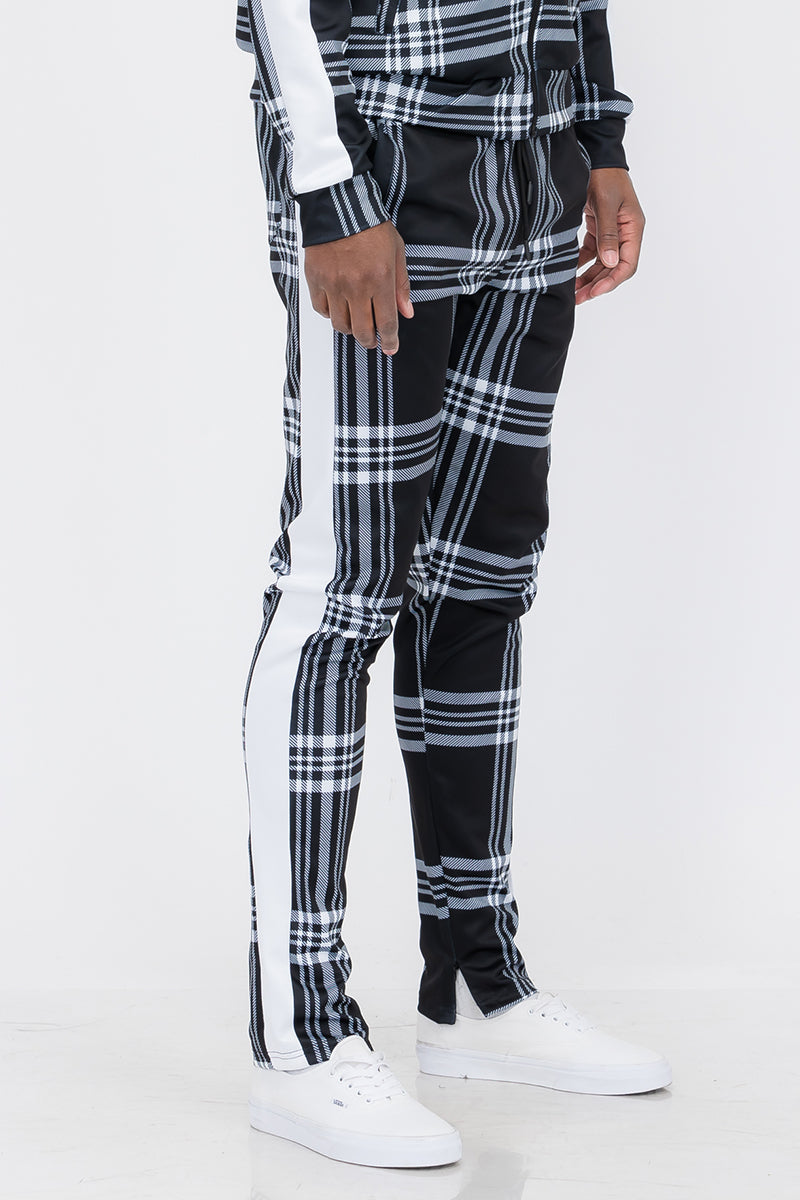 Plaid Out Track Pants featuring an elastic waist, drawstring, and ankle zippers, displayed on a model standing at 5'11 wearing a Large.