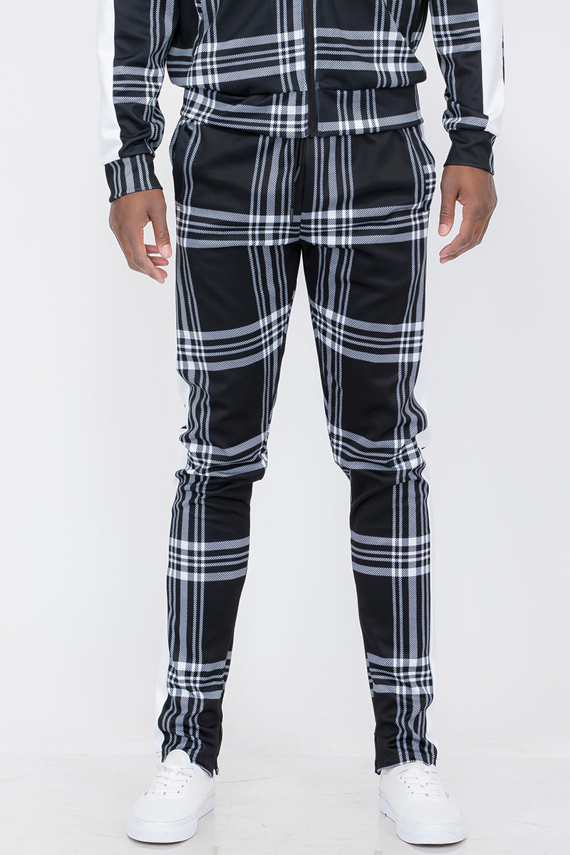 Plaid Out Track Pants featuring an elastic waist, drawstring, and ankle zippers, displayed on a model standing at 5'11 wearing a Large.