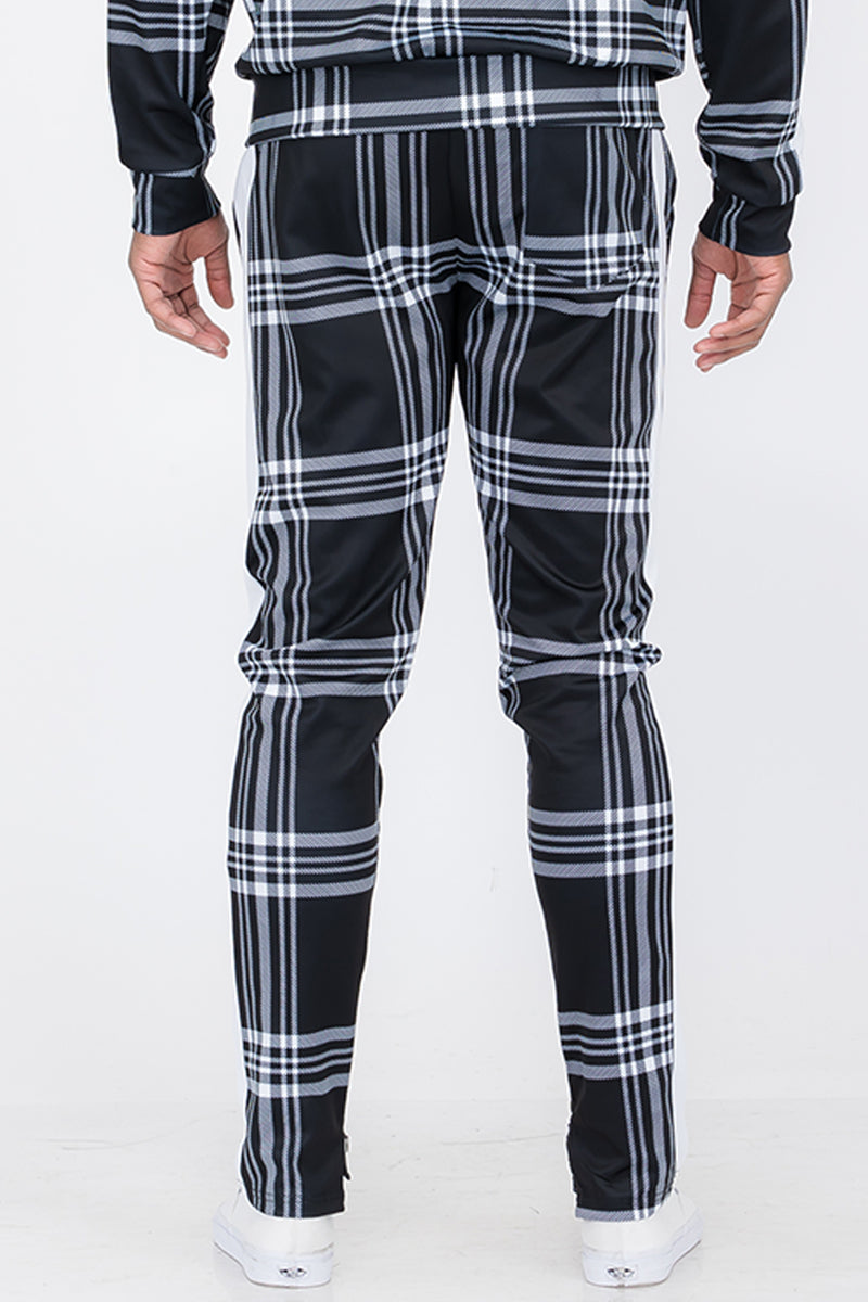 Plaid Out Track Pants featuring an elastic waist, drawstring, and ankle zippers, displayed on a model standing at 5'11 wearing a Large.