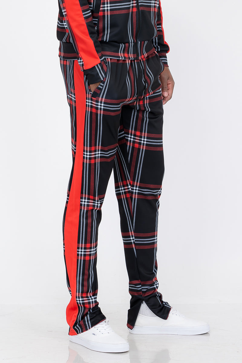 Plaid Out Track Pants featuring an elastic waist, drawstring, and ankle zippers, displayed on a model standing at 5'11 wearing a Large.