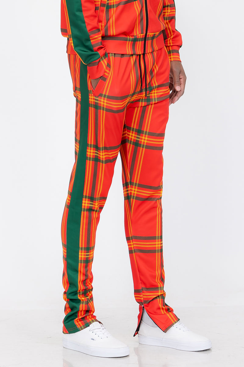 Plaid Out Track Pants featuring an elastic waist, drawstring, and ankle zippers, displayed on a model standing at 5'11 wearing a Large.