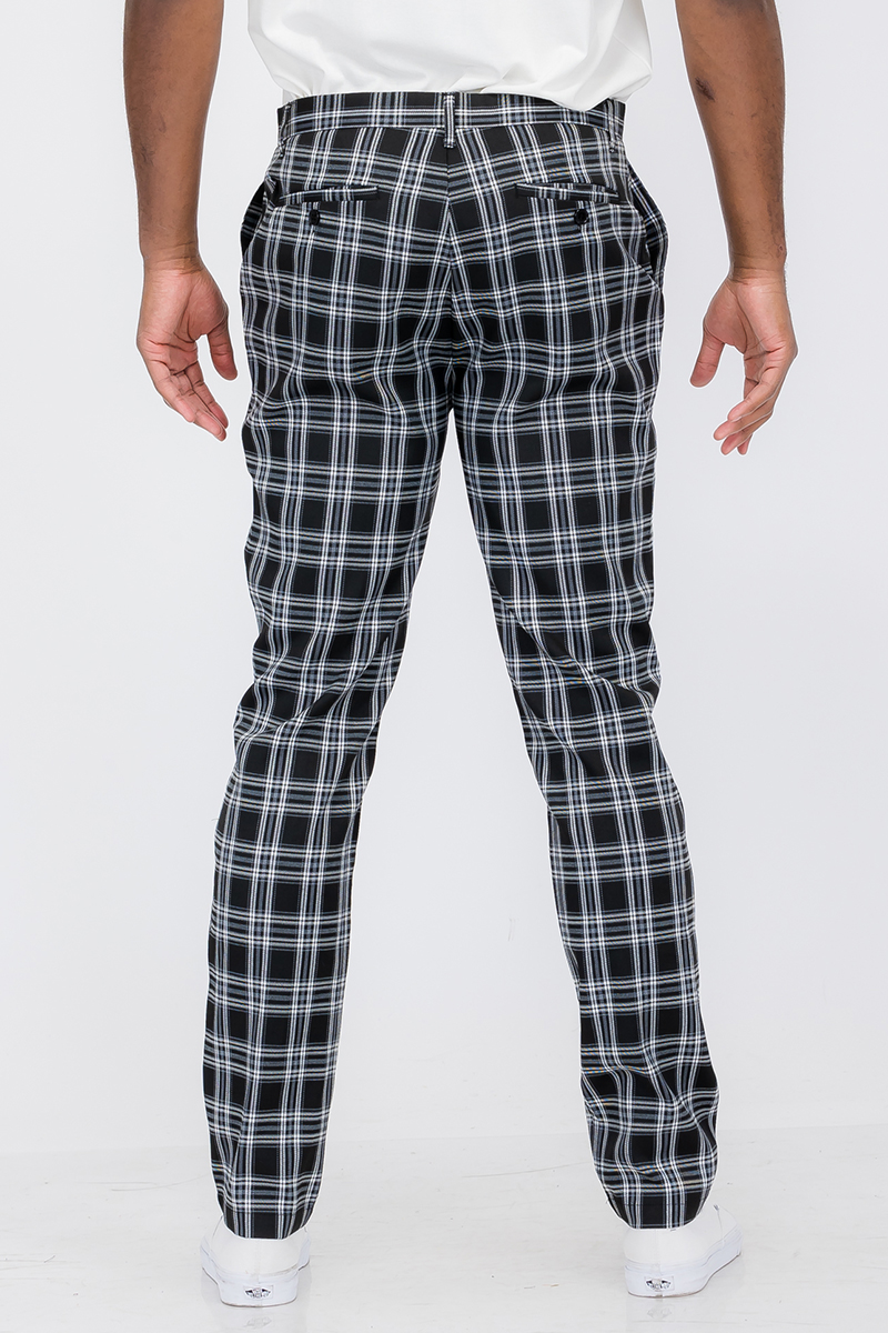 A pair of stylish plaid slim fit trouser pants featuring a button fly closure and standard pockets, ideal for modern fashion.