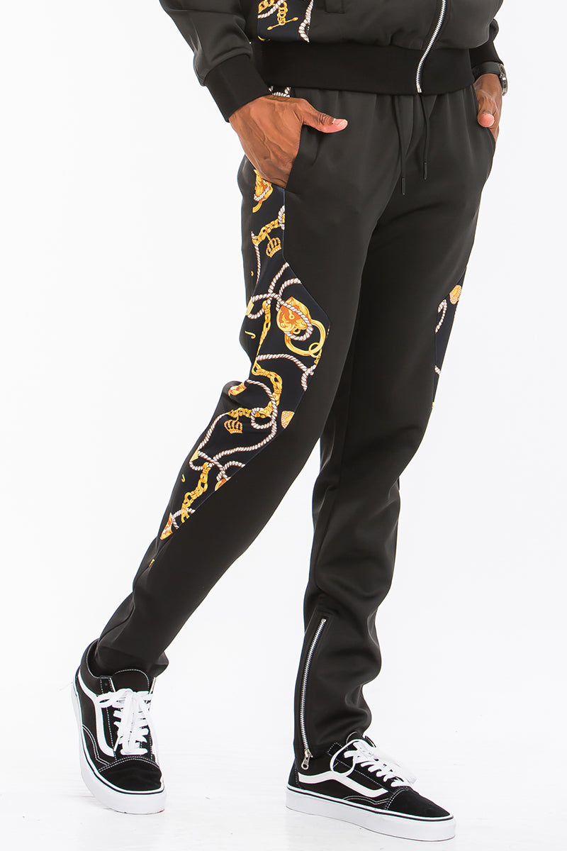 A stylish Poly Span Printed Track Set featuring a regular fit, tug-free zipper pocket, and hidden ankle zippers, perfect for workouts and casual wear.