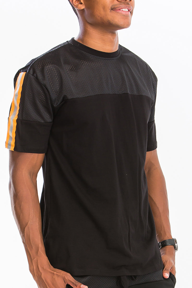 A stylish Quarter Mesh Cotton Tee featuring a soft mesh and cotton blend fabric with reflective tape detail.