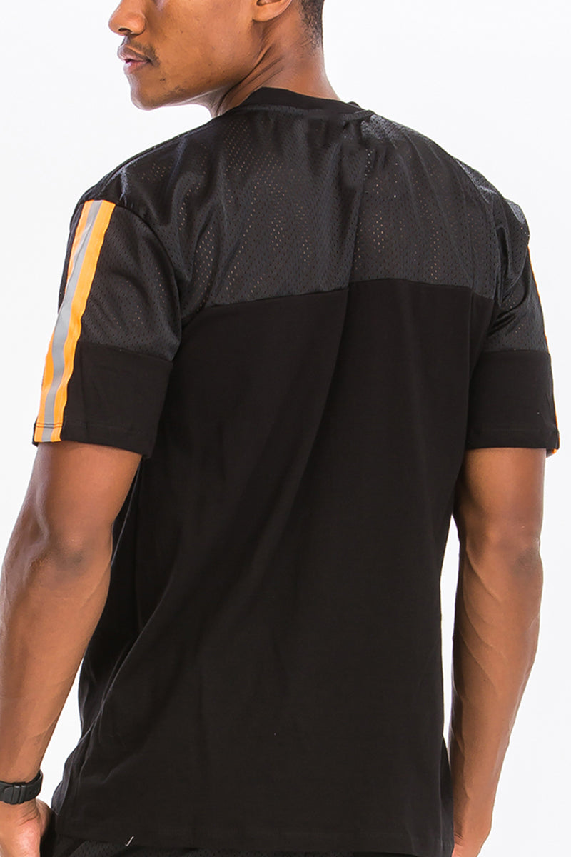 A stylish Quarter Mesh Cotton Tee featuring a soft mesh and cotton blend fabric with reflective tape detail.