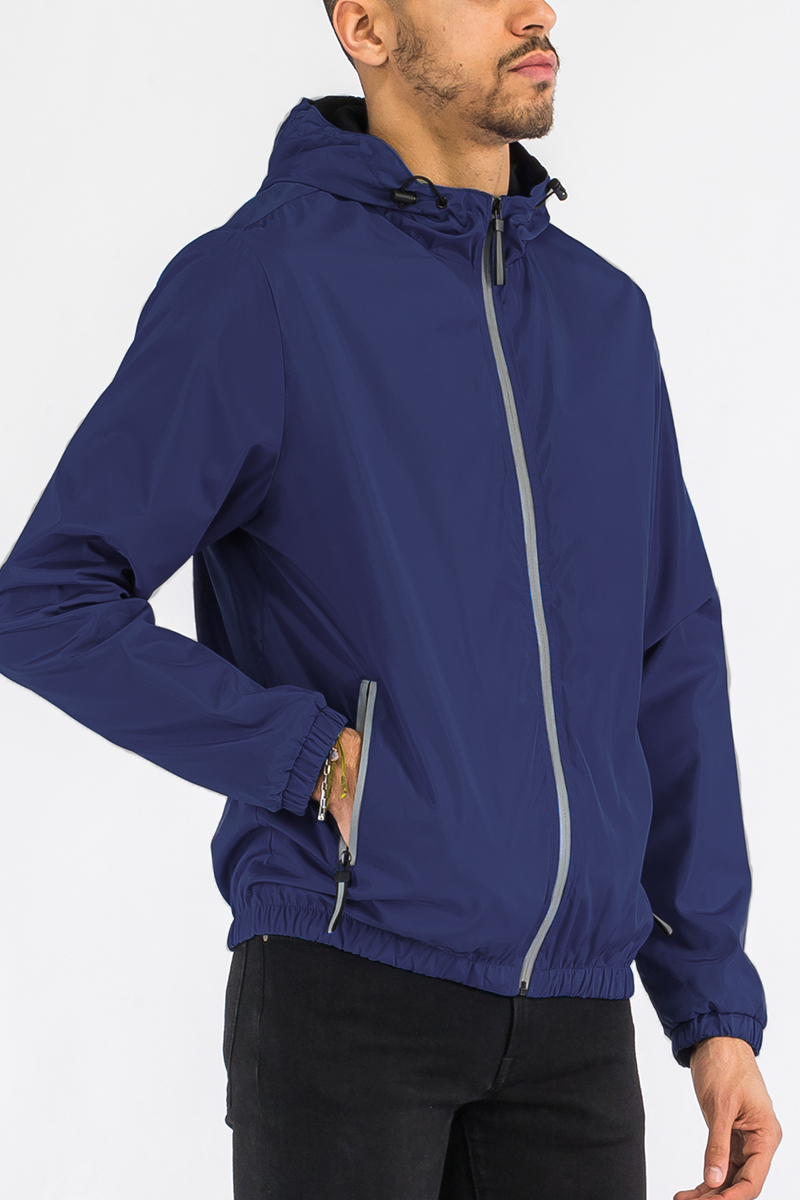 A stylish reflective zip windbreaker jacket in a vibrant color, featuring a full zip closure and hood, ideal for outdoor activities.