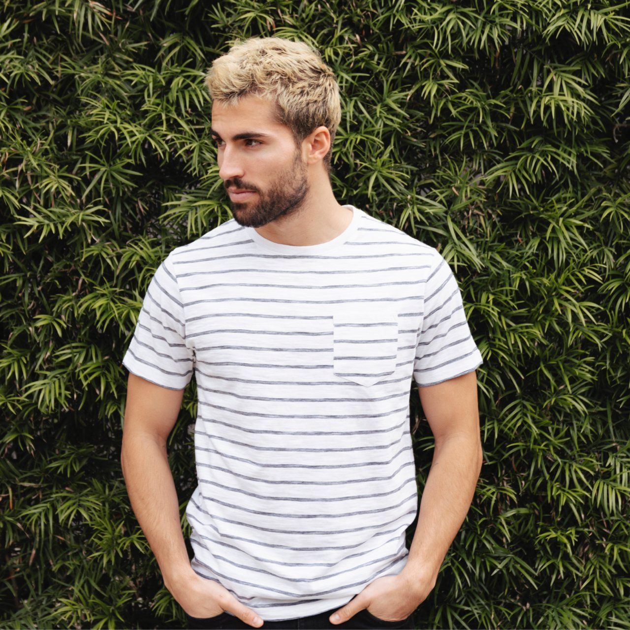 Rick Striped Tee featuring thin stripes, short sleeves, and a crew neck design, made from 100% cotton in an eco-friendly factory.