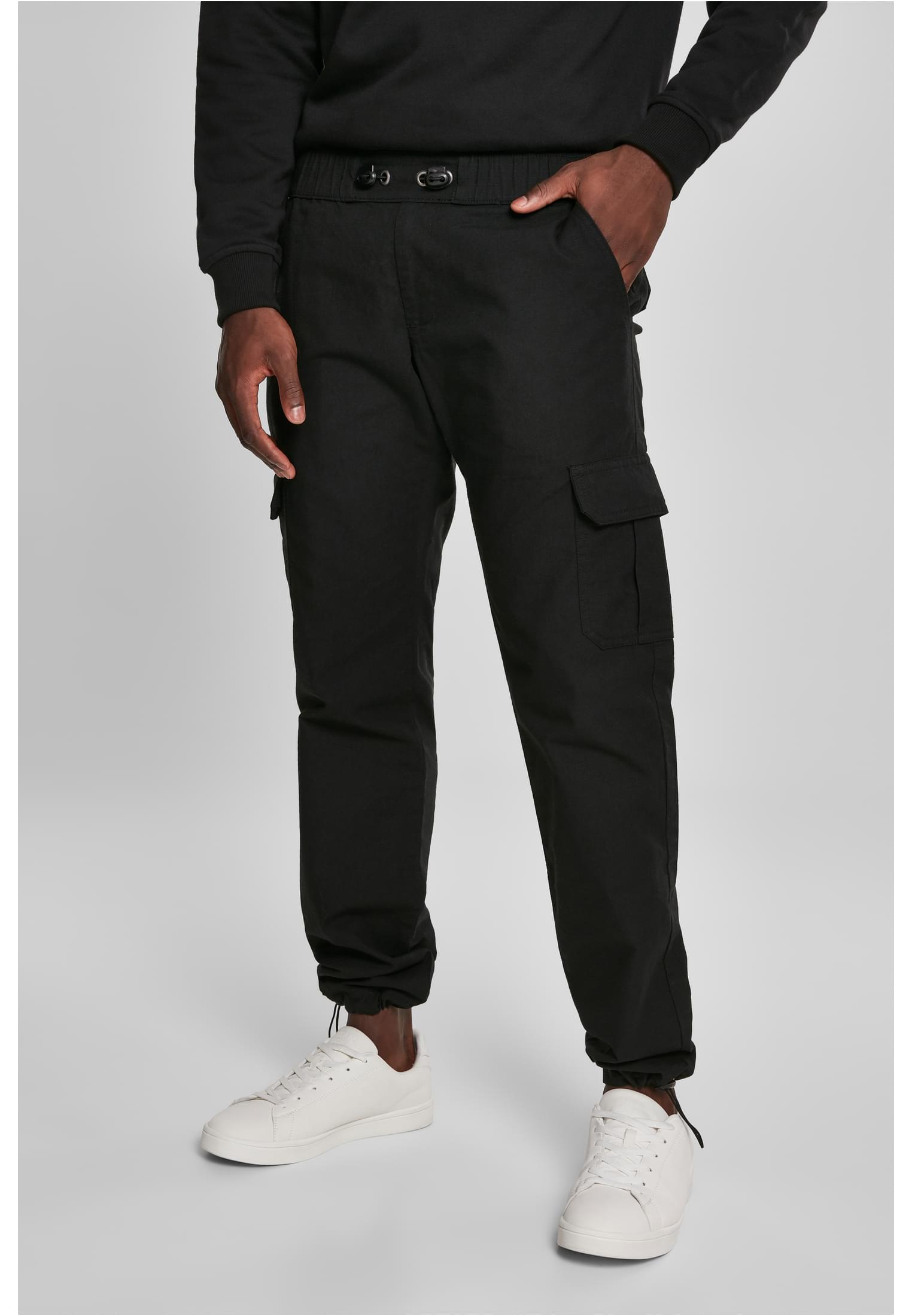 A pair of Ripstop Cargo Pants made from durable cotton twill, featuring multiple pockets and an elastic waistband for a comfortable fit.