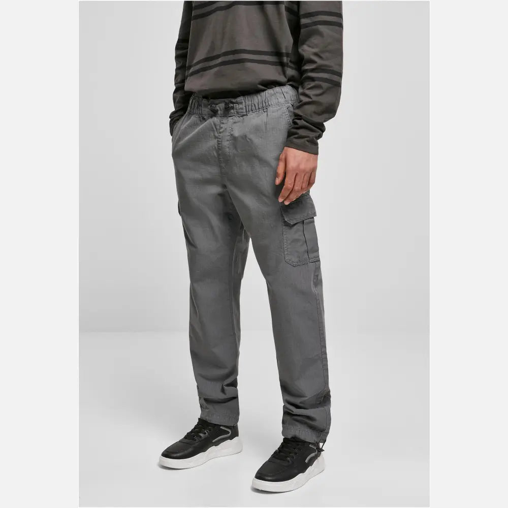 A pair of Ripstop Cargo Pants made from durable cotton twill, featuring multiple pockets and an elastic waistband for a comfortable fit.