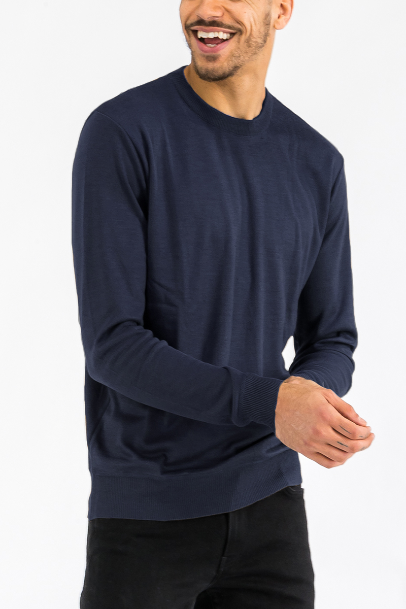 A cozy round neck knit sweater in a soft fabric, showcasing a classic design suitable for casual wear.