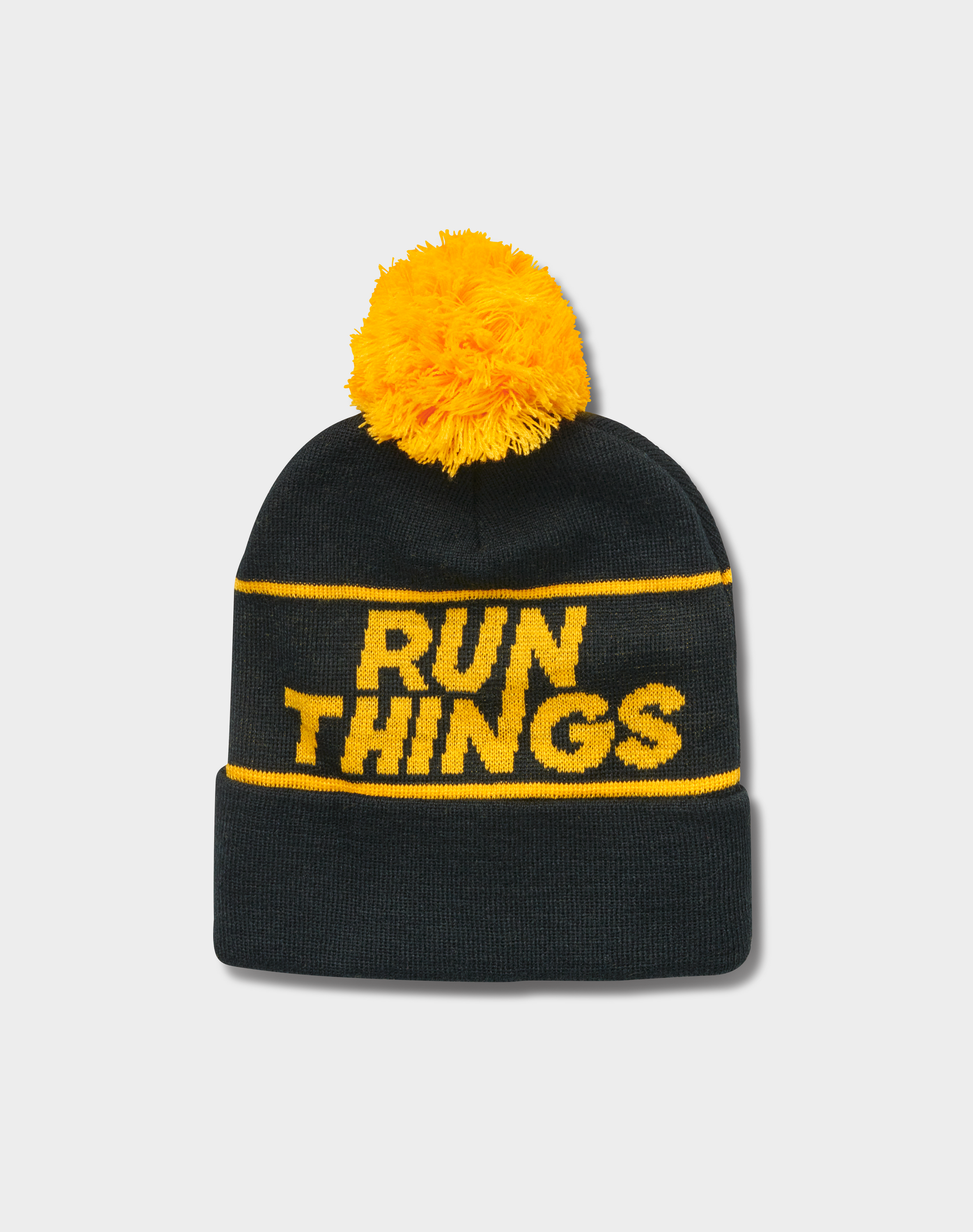 Run Things® Black & Gold Jacquard Pom-Pom Beanie featuring a stylish design with a pom-pom on top and a cuffed style for comfort.