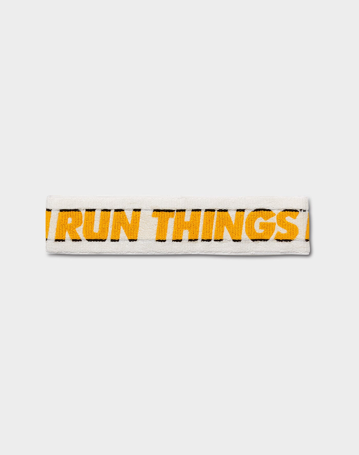 Run Things® Knit Logo Headband featuring jacquard knit logo and gold-black stripes, perfect for streetwear and athletic use.