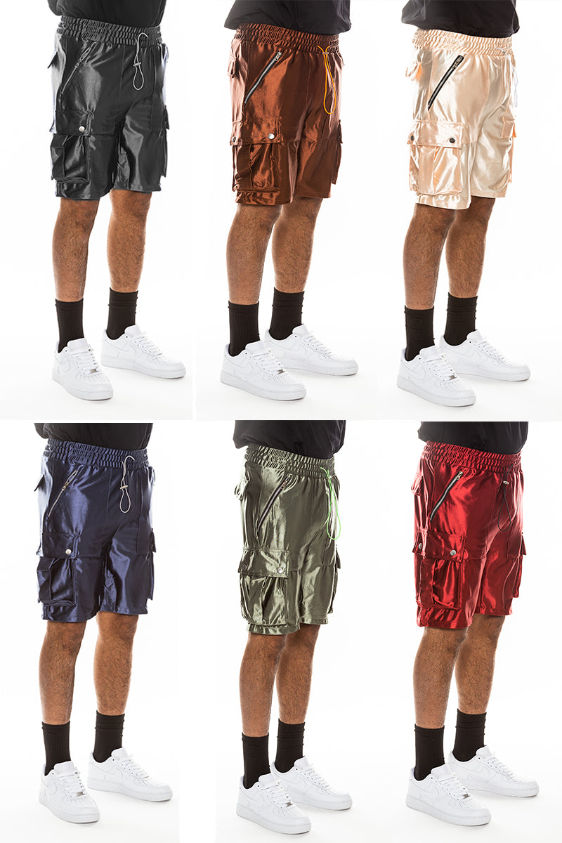 A pair of stylish satin cargo shorts featuring a colored drawstring, zippered pockets, and snap button cargo pockets, perfect for casual wear.