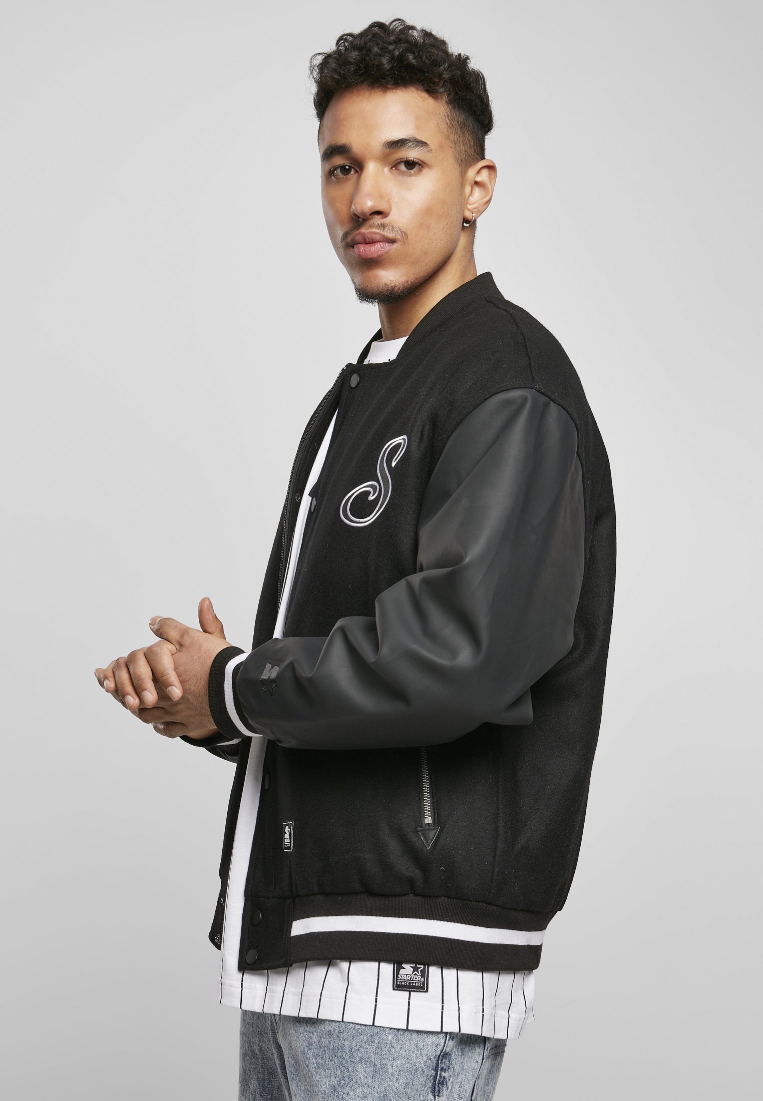 Men's Script College Jacket featuring faux leather sleeves, striped cuffs, and 'Starter' lettering on the back.