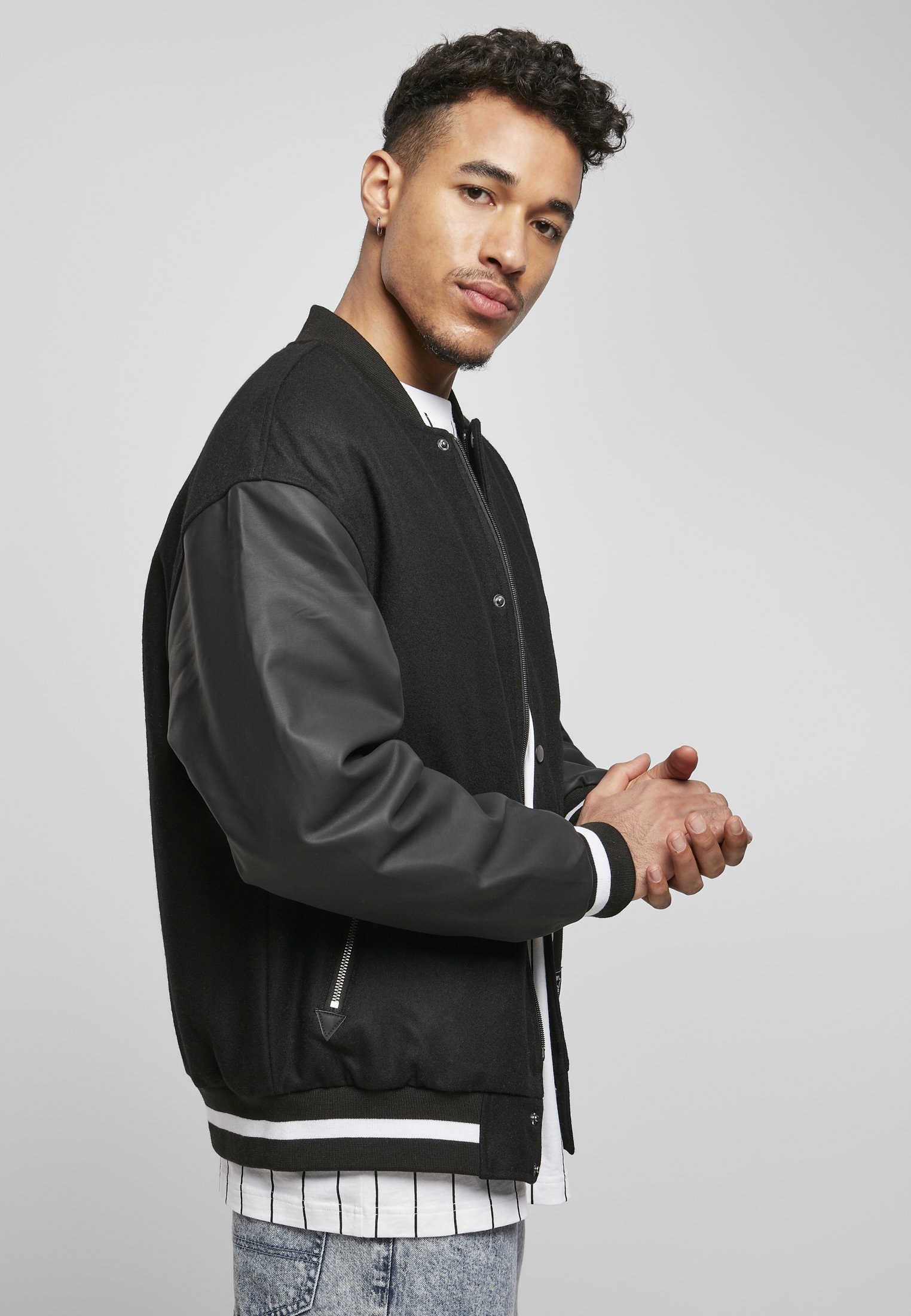 Men's Script College Jacket featuring faux leather sleeves, striped cuffs, and 'Starter' lettering on the back.