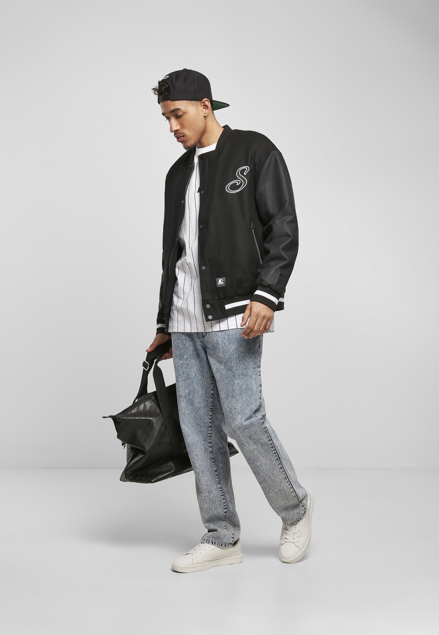 Men's Script College Jacket featuring faux leather sleeves, striped cuffs, and 'Starter' lettering on the back.