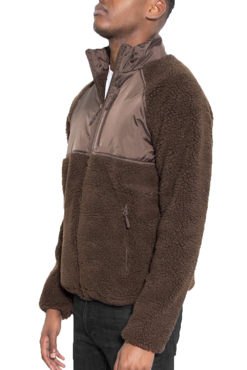 Sherpa Cut Out Fleece Jacket in a stylish design, featuring a full zip and zippered pockets, perfect for outdoor activities.