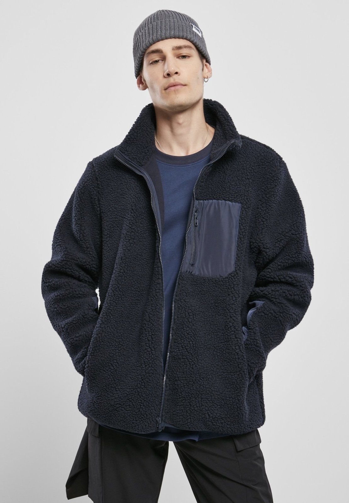 Men's Sherpa Jacket in Midnight Navy with zippered pockets and nylon inserts, showcasing a stylish and fluffy design.