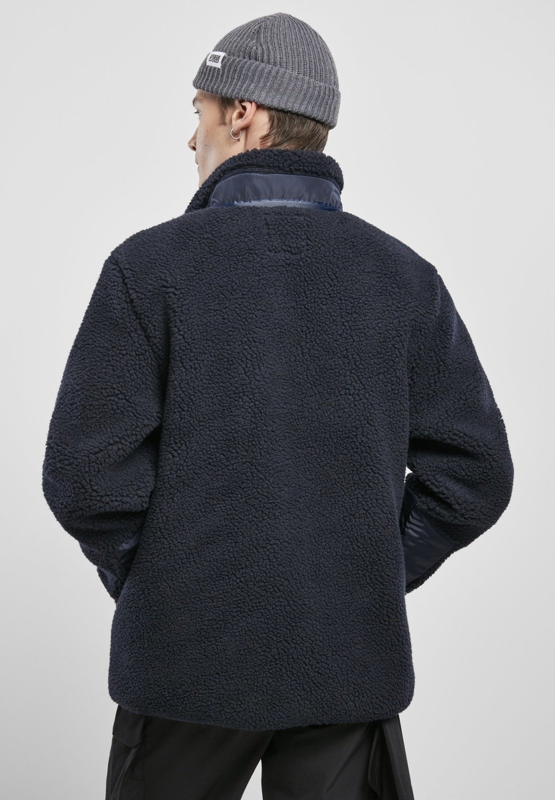 Men's Sherpa Jacket in Midnight Navy with zippered pockets and nylon inserts, showcasing a stylish and fluffy design.