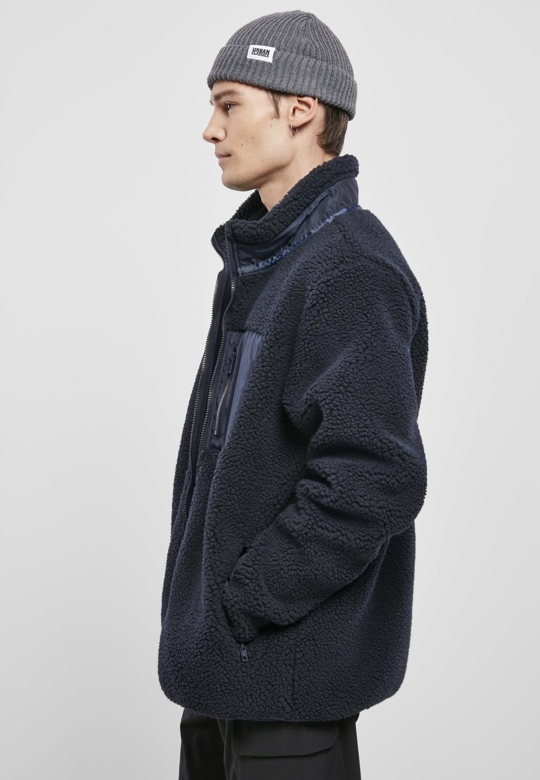 Men's Sherpa Jacket in Midnight Navy with zippered pockets and nylon inserts, showcasing a stylish and fluffy design.