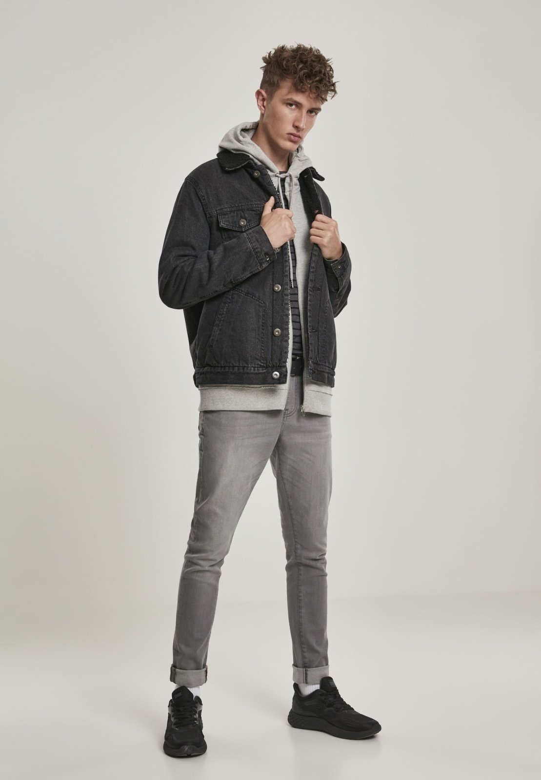 Sherpa Lined Jeans Jacket in Black Wash featuring cozy sherpa lining and durable denim fabric, perfect for stylish layering.