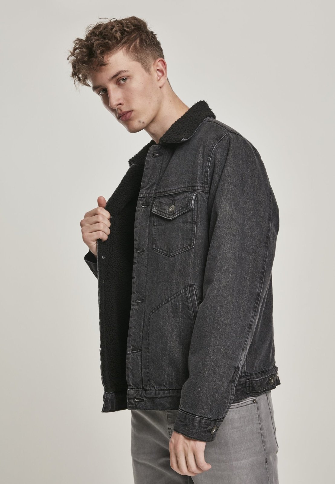 Sherpa Lined Jeans Jacket in Black Wash featuring cozy sherpa lining and durable denim fabric, perfect for stylish layering.