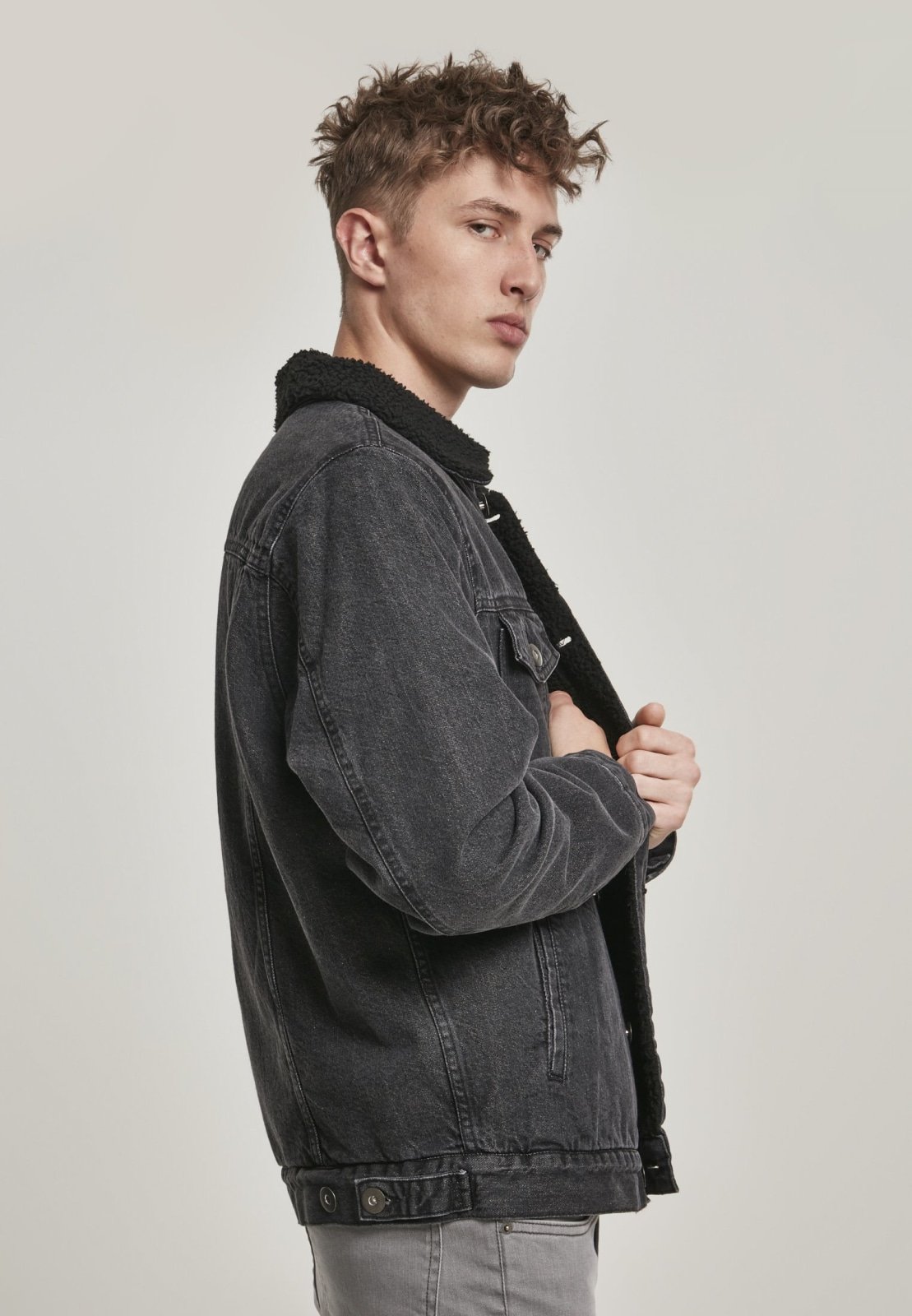 Sherpa Lined Jeans Jacket in Black Wash featuring cozy sherpa lining and durable denim fabric, perfect for stylish layering.