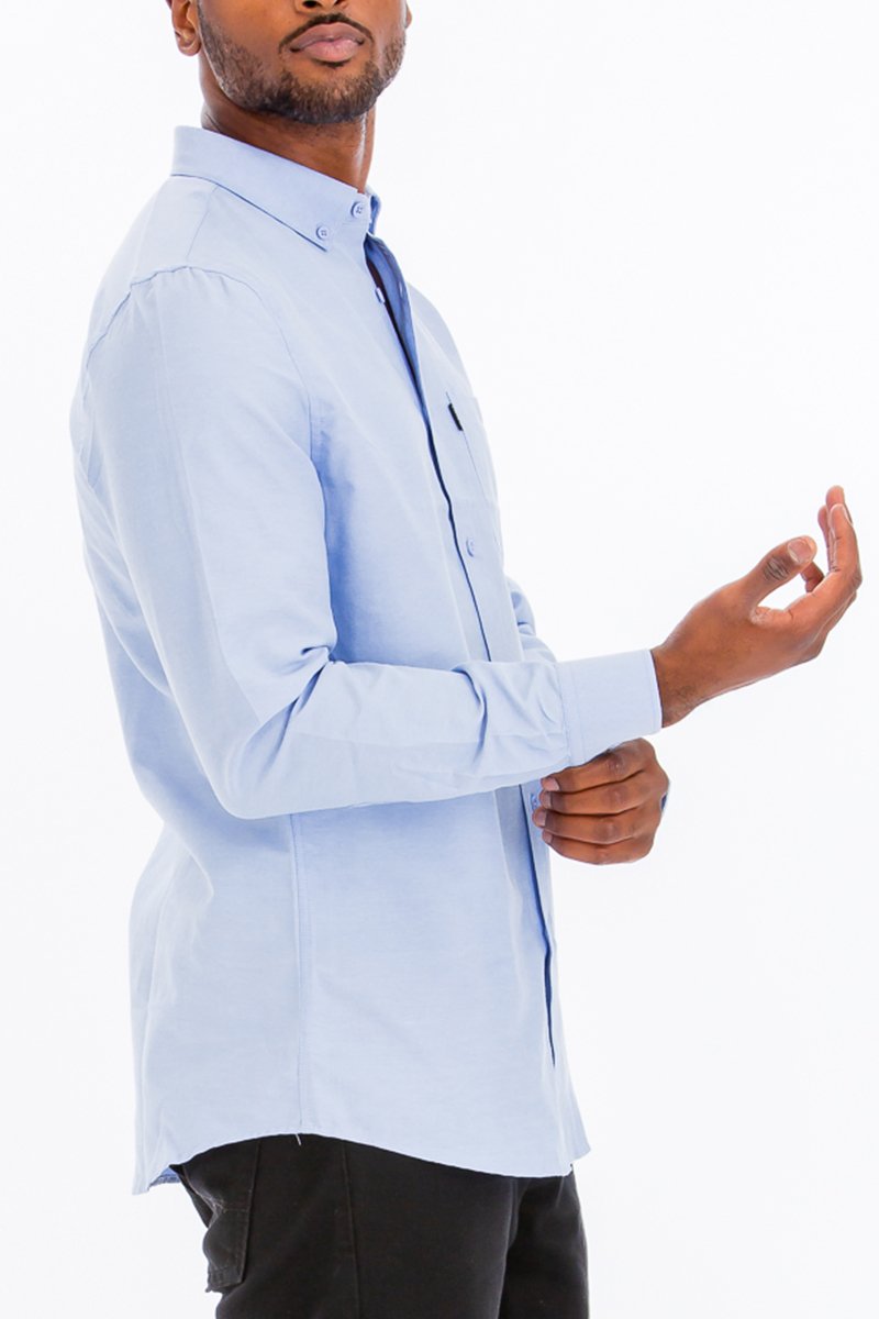 A stylish Signature Long Sleeve Button Down Shirt displayed on a mannequin, showcasing its classic design and premium fabric blend.