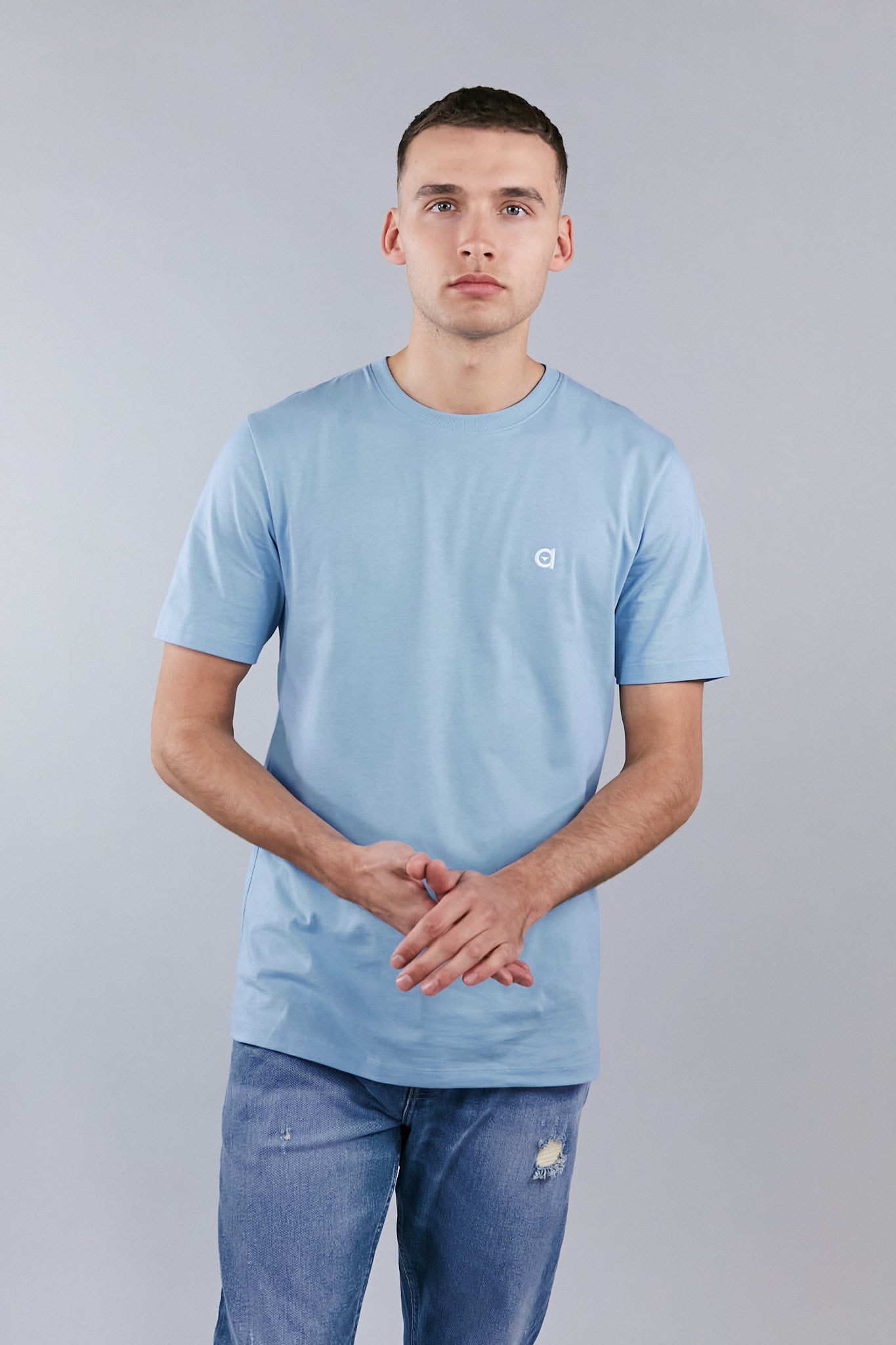 Sky blue low carbon t-shirt made from soft touch cotton, featuring an altid embroidered logo.