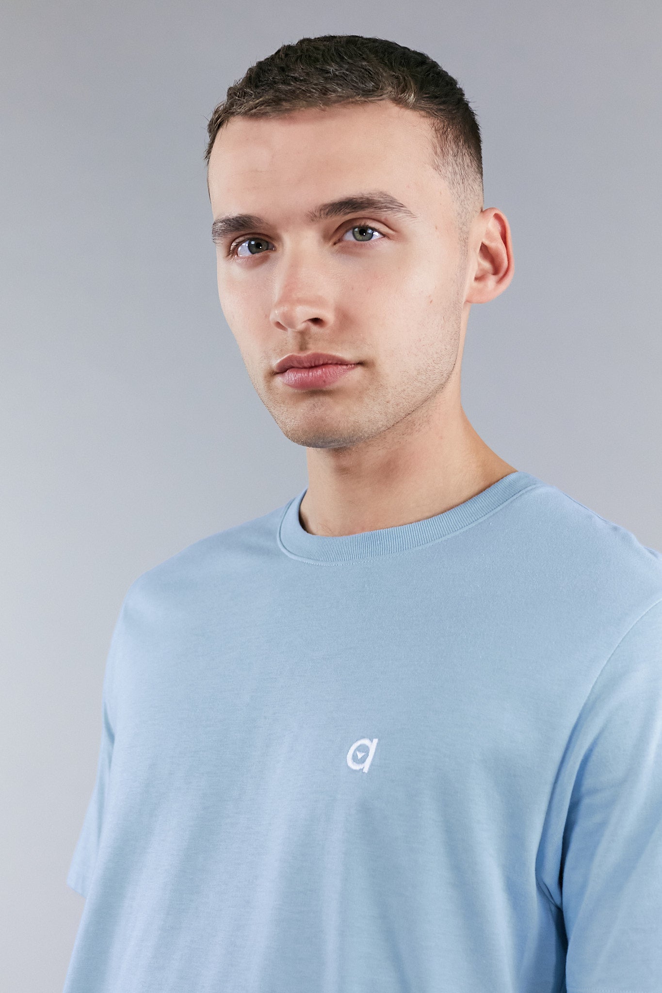 Sky blue low carbon t-shirt made from soft touch cotton, featuring an altid embroidered logo.