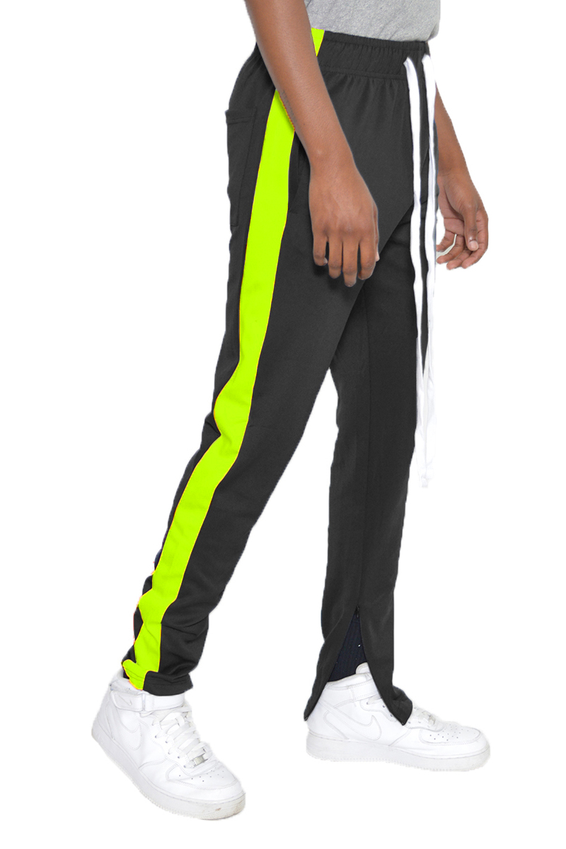 A pair of slim fit track pants featuring a single stripe detail, tug-free zipper closure, and hidden ankle zipper, displayed on a neutral background.