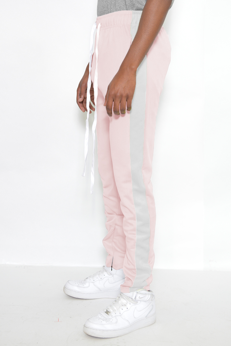 A pair of stylish slim fit track pants featuring a single stripe detail and hidden ankle zippers, perfect for workouts and casual wear.